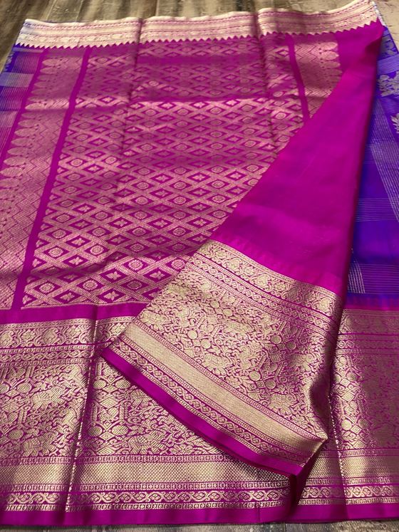 Magenta silk saree with gold brocade pallu and violet body